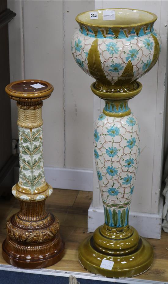 A Burmantofts green glazed jardiniere and two pedestals (3)